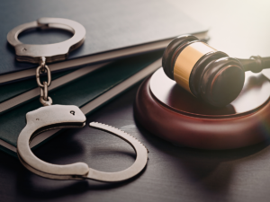 Handcuffs and a judges gavel.